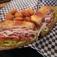 Smoked Turkey and Bacon Sandwich · Wheat berry bread, smoked turkey, bacon, cheddar cheese, lettuce, tomato, onions, pickle and...