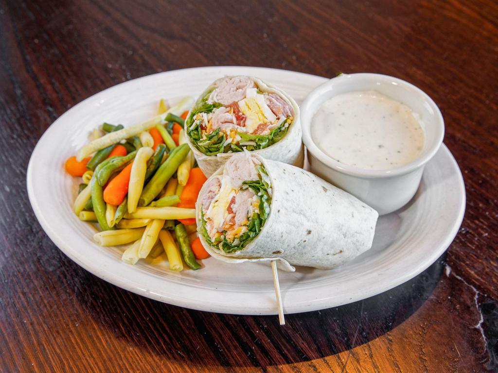 Chef Wrap · Smoked turkey, ham, fresh lettuce, 3 cheese blend,  red onion, tomatoes, hard-boiled egg, crouton and choice of dressing.