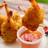 06. Coconut Shrimp · 4 pieces. Shrimp coated in a crispy golden brown coconut with sweet chili sauce.

