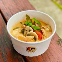 Tom Kha Kai · Coconut base soup with lemongrass, mushroom, and tomatoes.
