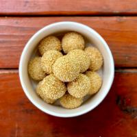 Sesame Ball · 9 pieces. The sesame seed balls filling with sweet red bean paste.