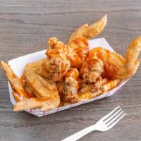 4  Jumbo Wings · Golden Jumbo Chicken wings served with fries, mild sauce, and coleslaw.