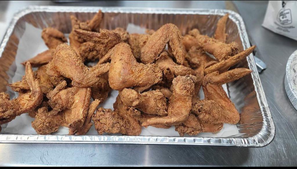 100 Jumbo Wings · 100 Golden Jumbo Chicken wings served with fries, mild sauce, and coleslaw.