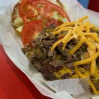 Italian beef cheeseburger  · Italian beef meat placed on top of a delicious beef burger with shredded cheese, lettuce, to...