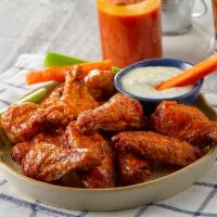 Traditional or Boneless Wing Basket · Seasoned and tossed in your choice of sauce.