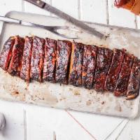 St. Louis-Style Spareribs · Hand-rubbed with Dave’s secret blend of spices and pit-smoked for 3 - 4 hours over a smolder...