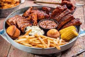 Feast for Two · Generous helpings of St. Louis-Style Spareribs, Country-Roasted Chicken, choice of Texas Bee...