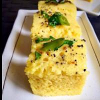 2 Piece Khaman Dhokla · Dhokla is a vegetarian food item that originates from the Indian state of Gujarat. It is mad...