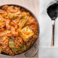 Kadai Paneer · Cheese cooked in traditional Indian wok, with onions peppers and tomatoes and sprinkle of ho...