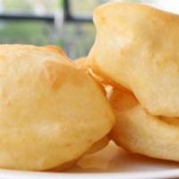 Bhatura  · A fluffy flour bhature  that is spongy and deep fried. Vegetarian.