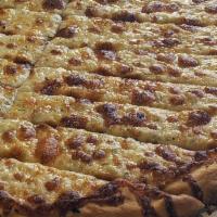 Garlic Cheesy Sticks · Garlic breadsticks covered with melted mozzarella, Jack, and cheddar.
