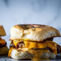 DA Baby OG Sliders (vegan) · Two mini Beyond Meat sliders on butter-toasted Hawaiian buns, Pickles, Cheddar Cheese, and G...