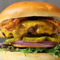 Ubetcha Classic Burger · Bacon, cheddar cheese, lettuce, tomato, onions, and pickles, and your choice of burger serve...