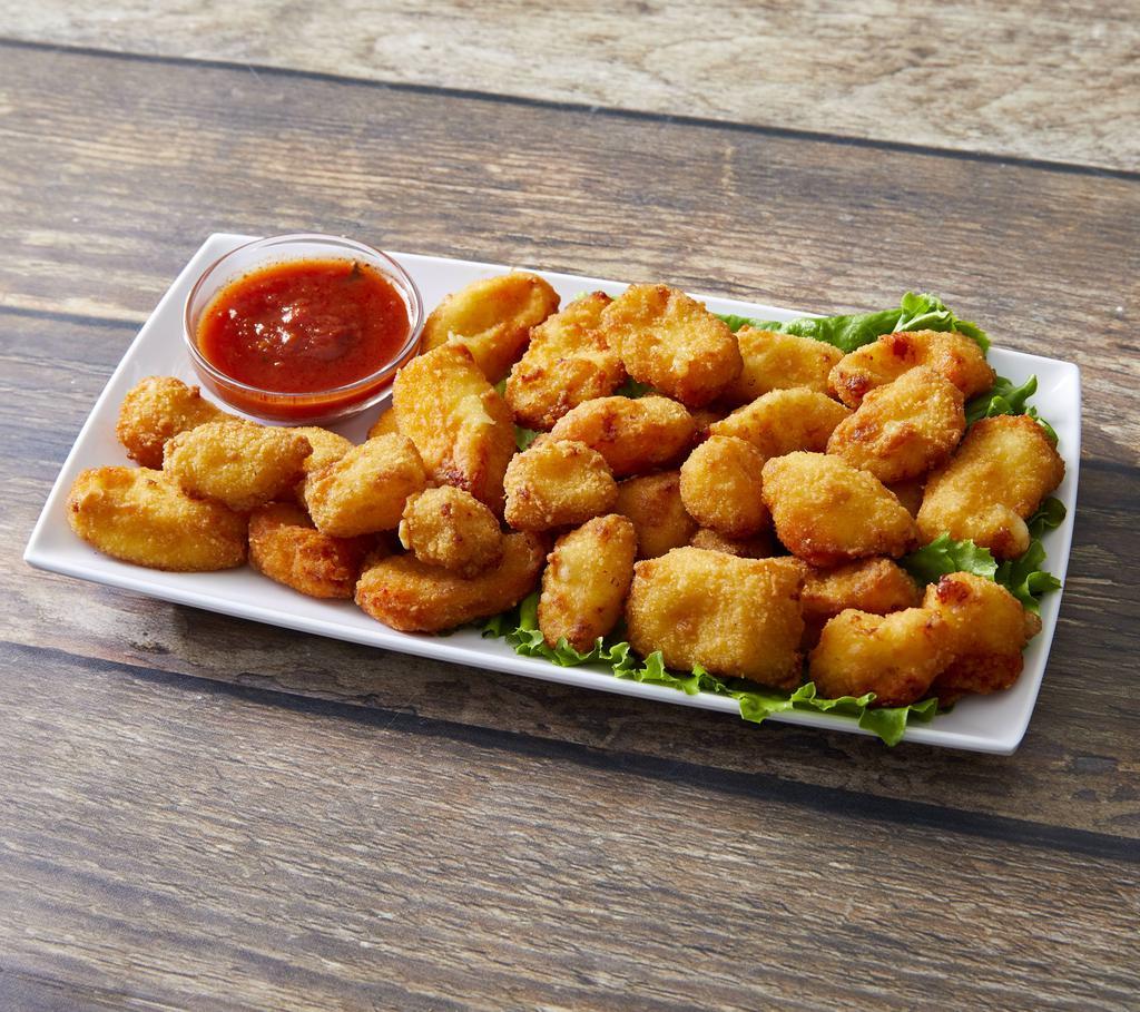 Wisconsin Cheese Curds · Fried white cheddar cheese curds.