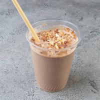 Nutty Me Smoothie · Banana, almond butter, cocoa powder, almond milk, maca powder, dates. Topped with toasted al...