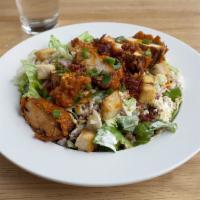 Buffalo Chicken Salad · Lettuce mix, cheddar jack, bacon, tomatoes, croutons, celery, buffalo chicken tenders, blue ...