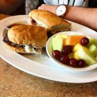 The French Dip Sandwich · Premium roast beef with melted provolone cheese and grilled onions. Served with au jus sauce...