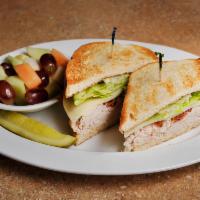 Turkey Club Sandwich · Smoked turkey breast piled high and topped with lettuce, provolone cheese, bacon and honey m...