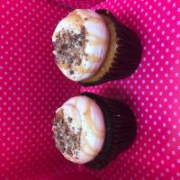 Satisfying Snickers Cupcake · Chocolate or vanilla cake with caramel buttercream frosting and topped with snicker pieces d...