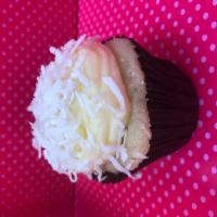 Coconut Cupcake · Vanilla cake with a coconut cream cheese frosting and shredded coconut 