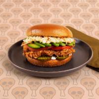 Deluxe Fried Chicken Sandwich · Crispy fried chicken breast with tomatoes, coleslaw, pickles, and ranch on a buttery brioche...