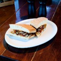 Cheese Steak Sandwich · Thinly sliced marinated beef, chipotle aioli, melted cheddar cheese, roasted peppers and oni...