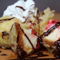 Tempura Cheescake · Lightly tempura fried topped with whip cream and chocolate syrup.