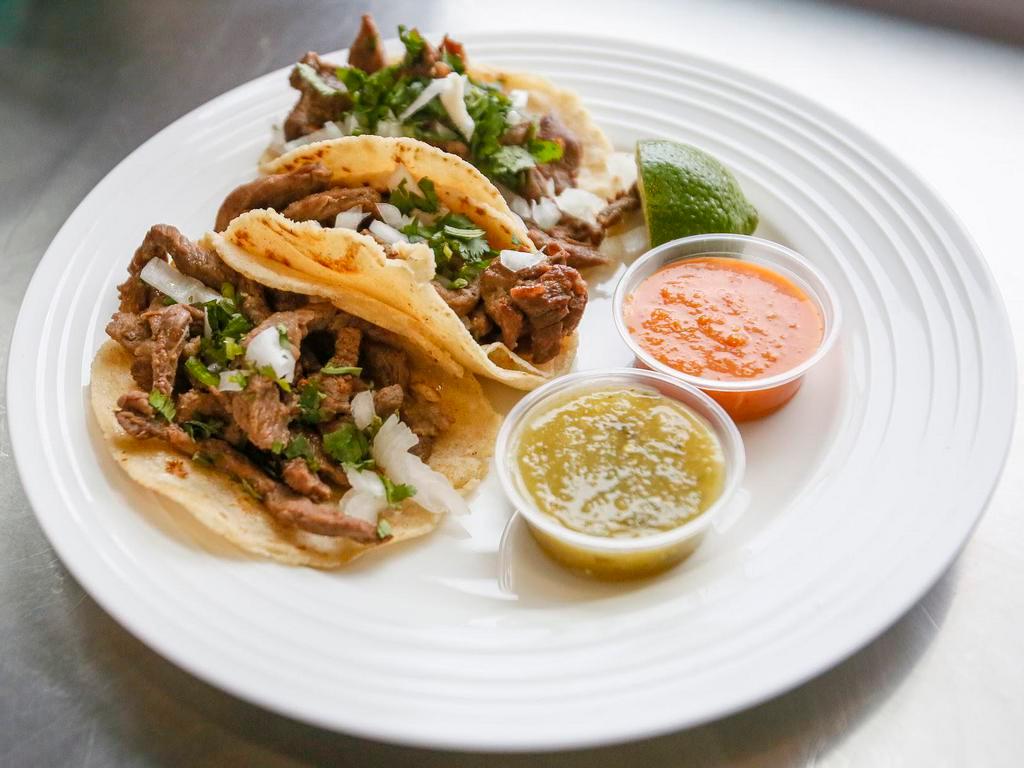 Tacos · Soft tortilla, choice of meat, cilantro and onion.