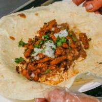 Burrito · Flour tortilla, choice of meat, beans, rice, cilantro and onion.