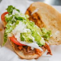 Torta · Soft style bread, choice of meat, beans, onion, tomato and jalapenos.