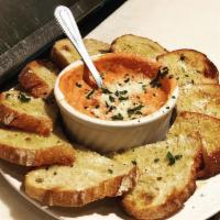 Baked Goat Cheese Pomodoro  Plate · House made red sauce, goat and Parmesan cheese served with artisan sourdough bread.