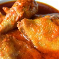 Chicken Leg Quarter in Sheba Stew · Chicken Leg Quarters cooked in a tomato base sauce seasoned with garlic, ginger, curry and o...