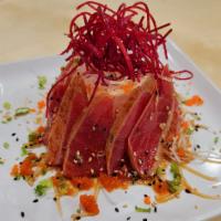 Tuna Tataki · Seared thin sliced tuna with sesame seeds and scallion in ponzu sauce.