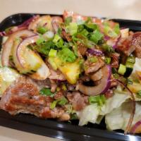Beef Salad · Grilled steak mixed with lime juice, red onion, scallion, cilantro and fresh Thai spices on ...
