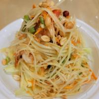 Thai Papaya Salad with Shrimp · Shredded green papaya with carrot, tomato, green bean, peanut and lime juice on a bed of let...