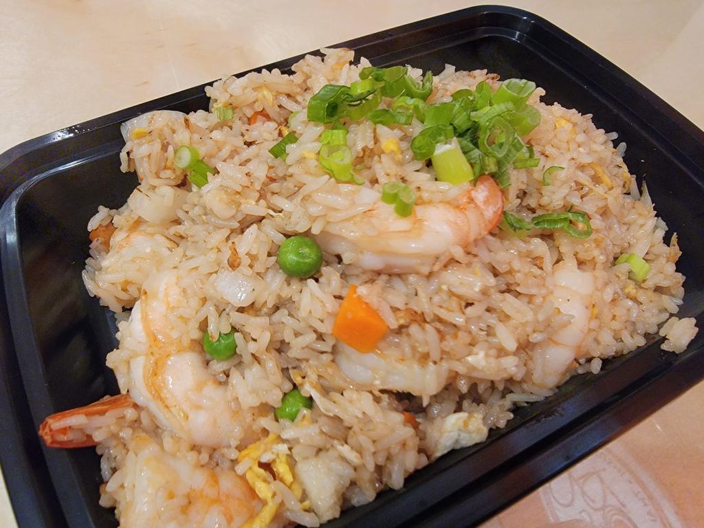 Fried Rice · Stir-fried rice with egg, carrot, peas, onions and topped with scallions.