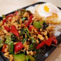 Rice and Roll Chicken Basil · Ground chicken sauteed with fresh basil, onion, bell pepper. Served over rice and topped wit...
