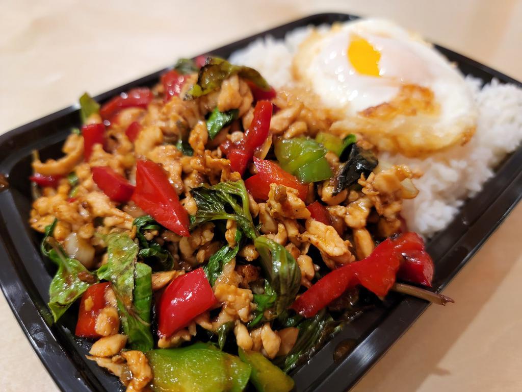 Rice and Roll Chicken Basil · Ground chicken sauteed with fresh basil, onion, bell pepper. Served over rice and topped with fried egg. Spicy.