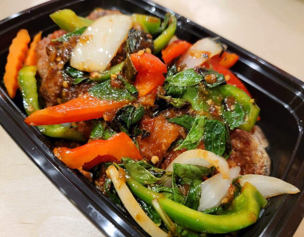 Duck Basil · Crispy duck sauteed with fresh basil, onion and bell pepper. Served on top of mixed vegetables. Spicy.