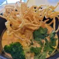 Curry Ramen · Thai red curry soup with Japanese ramen noodle and topped with crispy noodle, broccoli, scal...