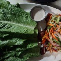 Pork Lettuce Wrap · fried pork, spiced pickled vegetables,
 black garlic creme fraiche