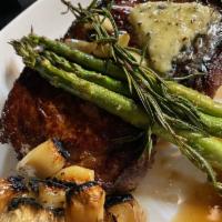 16oz Ribeye · rosemary butter, seared in a cast iron skillet, grilled asparagus, whole roasted garlic, gre...