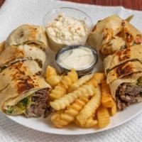 Traditional Beef Shawarma Sandwich · Thinly sliced roasted meat sandwich. 