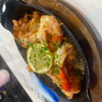 Sizzling Jumbo Shrimp Scampi · Grilled Shrimp served with garlic butter sauce
