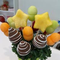 Mini Fruit Bouquet · Delicious Fruit Bouquet with chocolate-covered strawberries, pineapples, cantaloupe and hone...