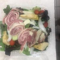 Antipasto Salad · Our Tossed salad with artichoke heart, prosciutto, capicola, salami and provolone cheese.