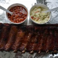 Full Slab with 2 Large sides Chose 2( baked beans, potato salad, cold slaw or fries) · St. Louis Style Ribs. Slow smoked for 6 hour
Choose 2 Large Sides and BBQ Sauce sweet and sp...