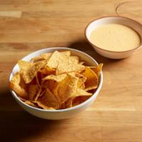 Mexican Village Queso Dip · Mexican cheese fondue, a combination of melted cheese, diced green chile and peppers, served...