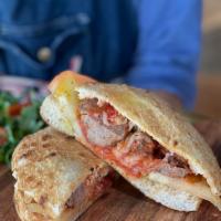 Panini Meatball · Our homemade bread with beef and veal meatballs with fresh tomatoes, mozzarella, & parmesan ...