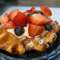 Waffles Order · 2 belgian waffles, strawberries, powdered sugar and syrup.